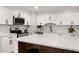 Bright kitchen with a large island, modern appliances, and white cabinets at 3152 Normandy Ne Cir, Marietta, GA 30062