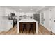 Well-designed kitchen featuring an island with seating, stainless appliances, and white cabinets at 3152 Normandy Ne Cir, Marietta, GA 30062