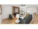 Bright living room with a modern fireplace, stylish furniture, and wood floors at 3152 Normandy Ne Cir, Marietta, GA 30062