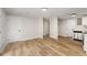 Open living room featuring hardwood floors and a modern kitchen with stainless steel appliances at 3152 Normandy Ne Cir, Marietta, GA 30062