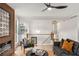 Beautiful living room with a modern fireplace, sleek ceiling fan, and an open view to the staircase at 3152 Normandy Ne Cir, Marietta, GA 30062