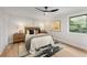 Cozy main bedroom offering a stylish fan, window, and décor at 3152 Normandy Ne Cir, Marietta, GA 30062