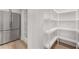 Spacious pantry with custom shelving and a stainless steel refrigerator at 3152 Normandy Ne Cir, Marietta, GA 30062