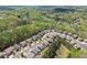 A bird's eye view of a tree-filled neighborhood and neatly kept lawns at 550 Eldridge Dr, Suwanee, GA 30024