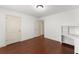 Bedroom with natural light and a built-in desk with shelves at 550 Eldridge Dr, Suwanee, GA 30024