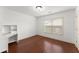 Bedroom with natural light and a desk with shelves at 550 Eldridge Dr, Suwanee, GA 30024