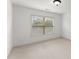 Bedroom with a window, white walls and neutral carpet at 550 Eldridge Dr, Suwanee, GA 30024