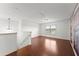 Bonus room features a hardwood floor and a decorative wall at 550 Eldridge Dr, Suwanee, GA 30024