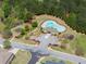 Image of the neighborhood pool with a building, playground, and parking lot at 550 Eldridge Dr, Suwanee, GA 30024
