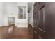 Bright entryway with gleaming hardwood floors, wainscoting, and a view of the staircase at 550 Eldridge Dr, Suwanee, GA 30024