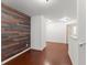 Open hallway featuring hardwood floors and wood accent wall at 550 Eldridge Dr, Suwanee, GA 30024