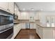 Well-appointed kitchen with granite countertops, stainless steel appliances, and custom cabinetry at 550 Eldridge Dr, Suwanee, GA 30024