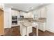 Well-lit kitchen with stainless steel appliances, granite countertops, and white cabinetry at 550 Eldridge Dr, Suwanee, GA 30024