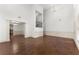 Spacious living room with hardwood floors, high ceilings, and elegant wainscoting at 550 Eldridge Dr, Suwanee, GA 30024