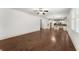 Spacious living room with hardwood floors that flows into the open kitchen area at 550 Eldridge Dr, Suwanee, GA 30024