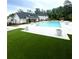 Community pool with a large pool deck and a covered section for residents to cool off at 1981 Freestone Way, Marietta, GA 30064