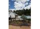 Community pool featuring a lounge space with seating and lush landscaping at 1981 Freestone Way, Marietta, GA 30064