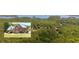 Nestled within a lush forest, this home offers serene privacy with a lake view in the distance at 3465 Summit Trl, Cumming, GA 30041