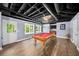 Basement game room featuring a pool table, egress to the exterior, and an open ceiling at 3465 Summit Trl, Cumming, GA 30041