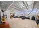 Finished basement featuring an open ceiling, modern flooring, and a comfortable seating area with ample recreational space at 3465 Summit Trl, Cumming, GA 30041