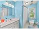 Clean bathroom with a single sink vanity, mirror, and a shower/tub combination with a white shower curtain at 3465 Summit Trl, Cumming, GA 30041