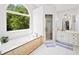 Luxurious bathroom features a soaking tub, large window, and separate shower for a spa-like experience at 3465 Summit Trl, Cumming, GA 30041