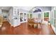 Bright breakfast nook featuring hardwood floors, large windows, and a view of the backyard at 3465 Summit Trl, Cumming, GA 30041