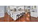 Spacious kitchen with a large island, granite countertops, white cabinets, and stainless steel appliances at 3465 Summit Trl, Cumming, GA 30041