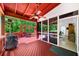 Enjoy the deck, complete with a ceiling fan, enclosed seating, and an outdoor kitchen at 3465 Summit Trl, Cumming, GA 30041