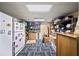 Ample storage room with a refrigerator and shelving for organization at 3465 Summit Trl, Cumming, GA 30041