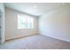 Bedroom with carpet and two windows bringing great natural light at 3981 Adler Cir, Buford, GA 30519