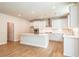 Kitchen features stainless appliances, an island, and plenty of cabinet space at 3981 Adler Cir, Buford, GA 30519