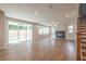 Living room with wood floors, a fireplace, and sliding glass doors leading to an outdoor space at 3981 Adler Cir, Buford, GA 30519