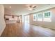 Open-concept living space with a modern kitchen, dining area, and sliding glass doors at 3981 Adler Cir, Buford, GA 30519