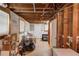 Unfinished basement featuring concrete walls, exposed ceiling, and access to utilities at 4048 Suzanne Ln, Duluth, GA 30096