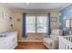 Bedroom room with hardwood floors, natural light, and soothing blue accents at 4048 Suzanne Ln, Duluth, GA 30096