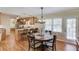 Dining area adjacent to the kitchen featuring hardwood floors and backyard access at 4048 Suzanne Ln, Duluth, GA 30096
