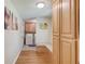 Hallway with a storage bench and access to the laundry room at 4048 Suzanne Ln, Duluth, GA 30096