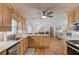 Open kitchen has granite countertops, stainless appliances and eat-in bar at 4048 Suzanne Ln, Duluth, GA 30096