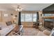 Comfortable living space with large windows, a fireplace, and classic furnishings at 4048 Suzanne Ln, Duluth, GA 30096