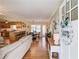 Open concept living area with wood floors, kitchen view, and a view to the dinning room at 4048 Suzanne Ln, Duluth, GA 30096