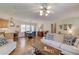 Open concept living space with an eat in kitchen, hardwood floors, and neutral decor at 4048 Suzanne Ln, Duluth, GA 30096