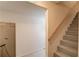 Stairway with gray-painted steps and light wood railing; leads down at 4048 Suzanne Ln, Duluth, GA 30096