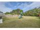 Spacious backyard features a playset, perfect for outdoor fun and Gathering activities at 4929 Dufour Dr, Lilburn, GA 30047