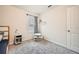 Bright bedroom with a window, soft carpet, and a white door offering a clean and simple design at 4929 Dufour Dr, Lilburn, GA 30047