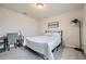 Bright bedroom featuring a bed, desk, soft carpet, and a floor lamp perfect for study and relaxation at 4929 Dufour Dr, Lilburn, GA 30047