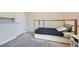 Comfortable bedroom showcasing a twin bed with soft carpet and a convenient closet door at 4929 Dufour Dr, Lilburn, GA 30047