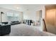 The bonus room features plush carpet, ample natural light and neutral wall paint at 4929 Dufour Dr, Lilburn, GA 30047