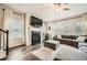Bright living room with fireplace, many windows and ceiling fan at 4929 Dufour Dr, Lilburn, GA 30047