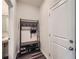 Inviting mudroom with a storage rack for shoes and personal items adjacent to the front door at 4929 Dufour Dr, Lilburn, GA 30047